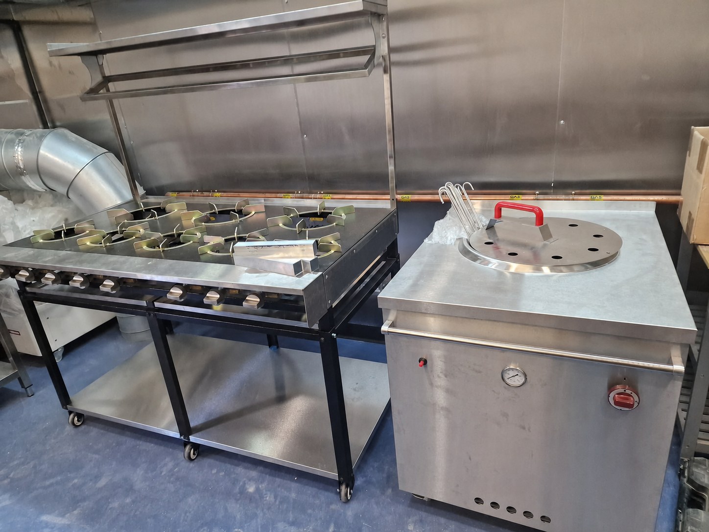 Commercial catering gas range and copper gas pipework in a Sheffield commercial kitchen